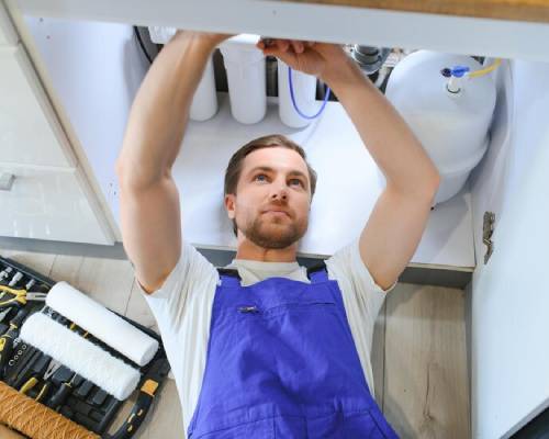 Technicians upgrading gas heater system