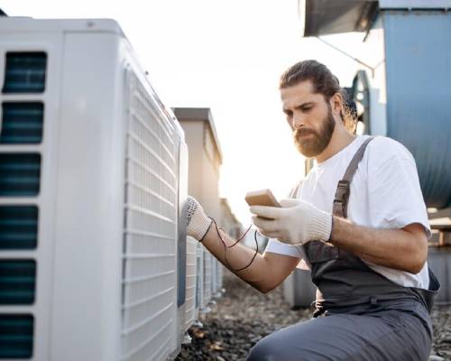 HVAC technicians checking Reverse Cycle Air Conditioner