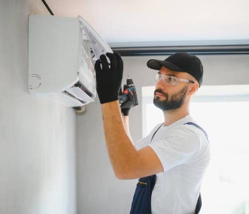 AC technicians repairing air conditioner