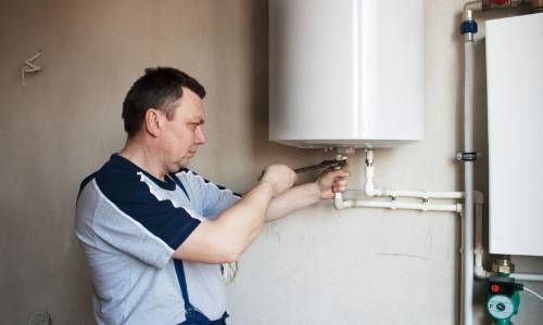 plumber installing upgraded water heater
